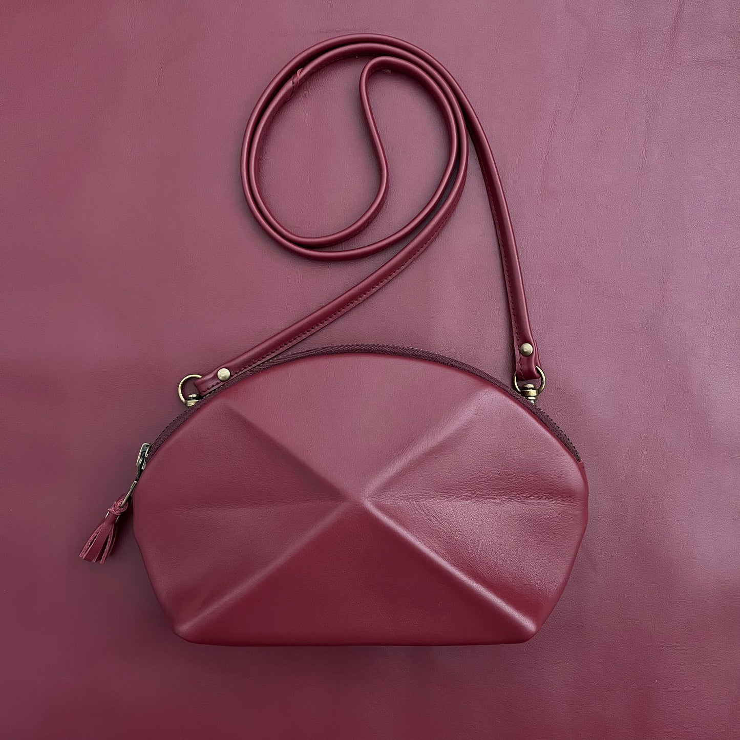 pyramid cross body bag burgundy red