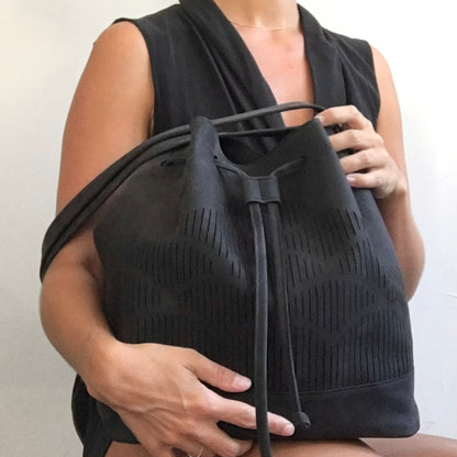 cut out bucket bag suede leather blue by lara kazis